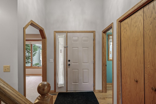 2970 Western Ave N, Roseville, MN 55113 - entrance foyer featuring a high ceiling, baseboards, and light wood finished floors