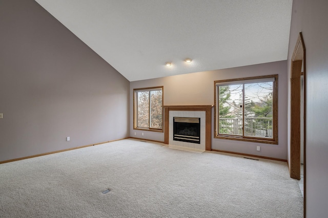 2970 Western Ave N, Roseville, MN 55113 - unfurnished living room featuring light carpet, a tile fireplace, baseboards, and lofted ceiling