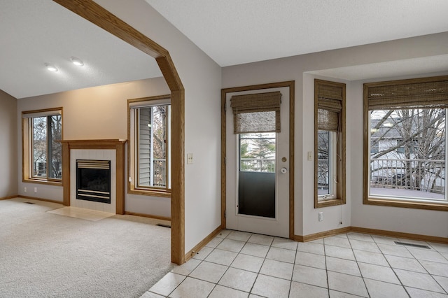 2970 Western Ave N, Roseville, MN 55113 - foyer entrance with healthy amount of natural light, baseboards, and a fireplace