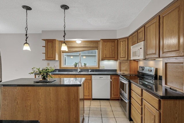 2970 Western Ave N, Roseville, MN 55113 - kitchen featuring white appliances, a sink, brown cabinets, pendant lighting, and a textured ceiling