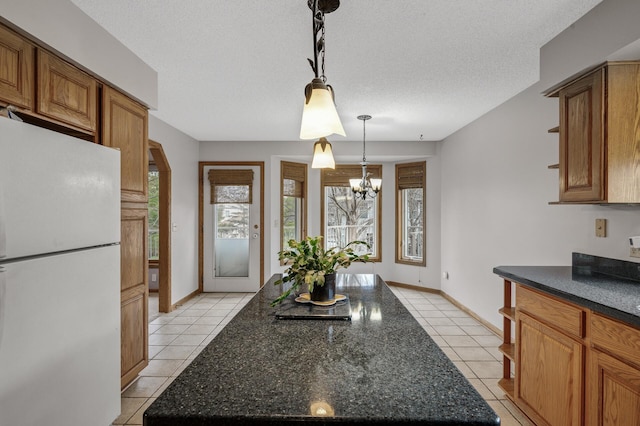 2970 Western Ave N, Roseville, MN 55113 - kitchen with freestanding refrigerator, light tile patterned floors, a chandelier, open shelves, and a textured ceiling