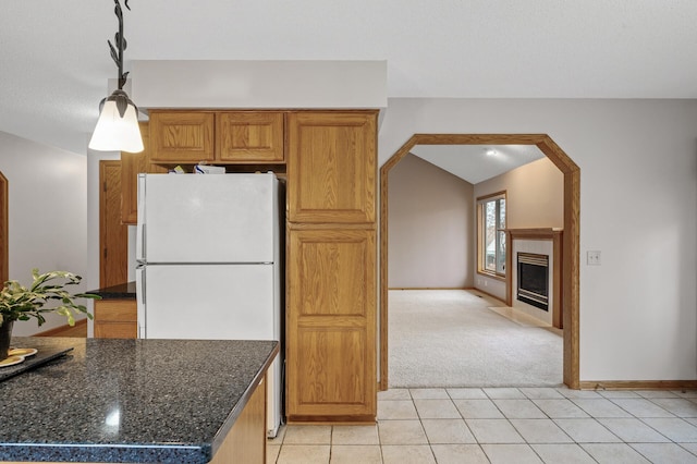 2970 Western Ave N, Roseville, MN 55113 - kitchen featuring freestanding refrigerator, light colored carpet, light tile patterned floors, baseboards, and vaulted ceiling
