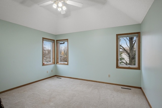 2970 Western Ave N, Roseville, MN 55113 - carpeted empty room featuring a ceiling fan, baseboards, and lofted ceiling