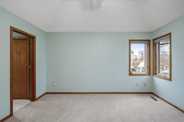 2970 Western Ave N, Roseville, MN 55113 - spare room featuring light colored carpet and baseboards