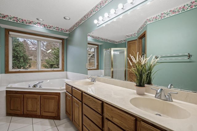2970 Western Ave N, Roseville, MN 55113 - full bath with a shower stall, tile patterned flooring, a garden tub, double vanity, and a textured ceiling