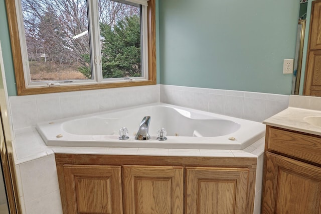 2970 Western Ave N, Roseville, MN 55113 - bathroom with healthy amount of natural light, a whirlpool tub, and vanity