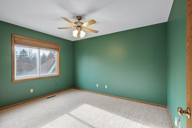 2970 Western Ave N, Roseville, MN 55113 - unfurnished room featuring carpet flooring, a ceiling fan, baseboards, and a textured ceiling