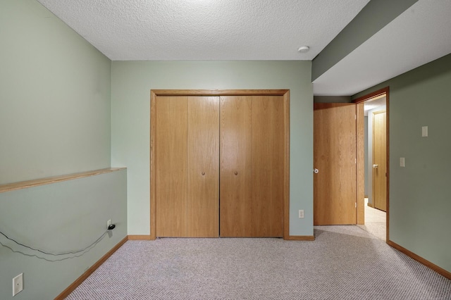 2970 Western Ave N, Roseville, MN 55113 - unfurnished bedroom with a closet, carpet floors, baseboards, and a textured ceiling