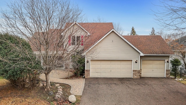2970 Western Ave N, Roseville, MN 55113 - traditional-style home featuring driveway, a shingled roof, brick siding, and an attached garage