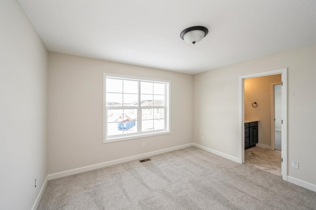 869 Greywood Blvd SW, Delano, MN 55328 - unfurnished room featuring light colored carpet and baseboards