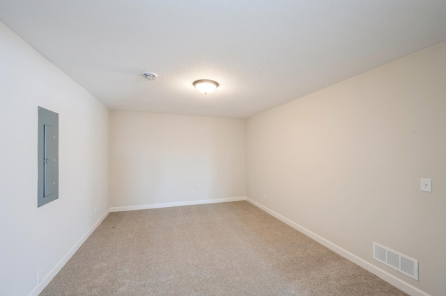 869 Greywood Blvd SW, Delano, MN 55328 - empty room with light colored carpet, baseboards, electric panel, and a smoke detector