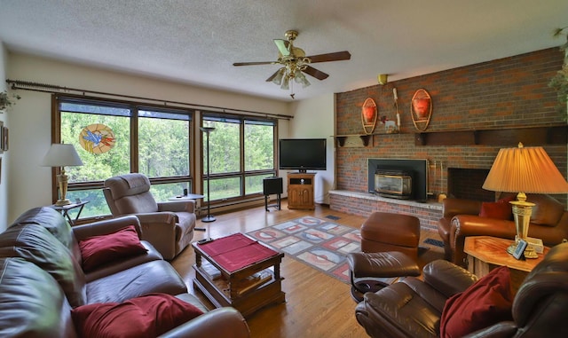 912 State 84 SW, Pine River, MN 56474 - living room featuring a ceiling fan, wood finished floors, and a textured ceiling