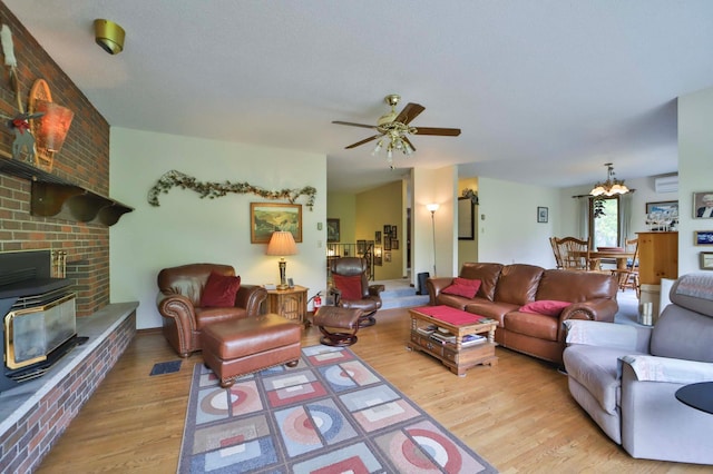 912 State 84 SW, Pine River, MN 56474 - living room featuring wood finished floors, a ceiling fan, and a wall mounted air conditioner
