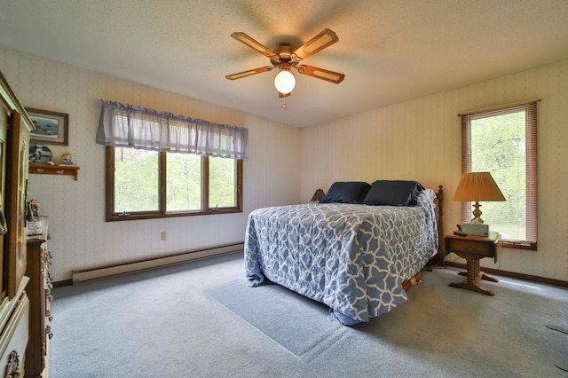 912 State 84 SW, Pine River, MN 56474 - carpeted bedroom featuring a baseboard heating unit and ceiling fan