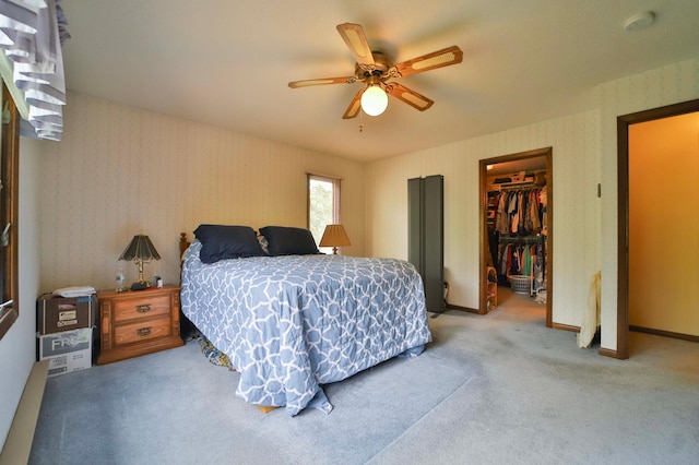 912 State 84 SW, Pine River, MN 56474 - carpeted bedroom with a spacious closet, wallpapered walls, a closet, and a ceiling fan