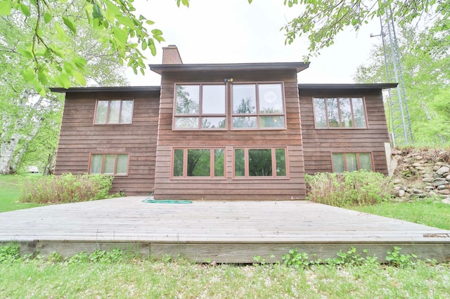 912 State 84 SW, Pine River, MN 56474 - back of house featuring a chimney and a deck