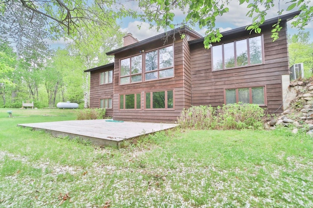 912 State 84 SW, Pine River, MN 56474 - rear view of house featuring a wooden deck, a chimney, and a yard
