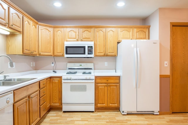 1930 Westridge Cir, Stillwater, MN 55082 - kitchen with white appliances, a sink, light countertops, light wood-type flooring, and recessed lighting