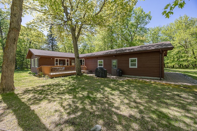 224 Norman Point Rd NW, Longville, MN 56655 - back of house with a wooden deck and a lawn