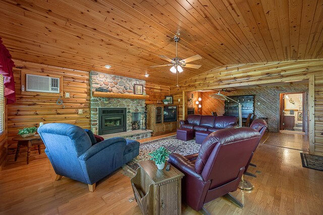 224 Norman Point Rd NW, Longville, MN 56655 - living room with wood ceiling, a fireplace, light wood-style floors, ceiling fan, and a wall mounted AC
