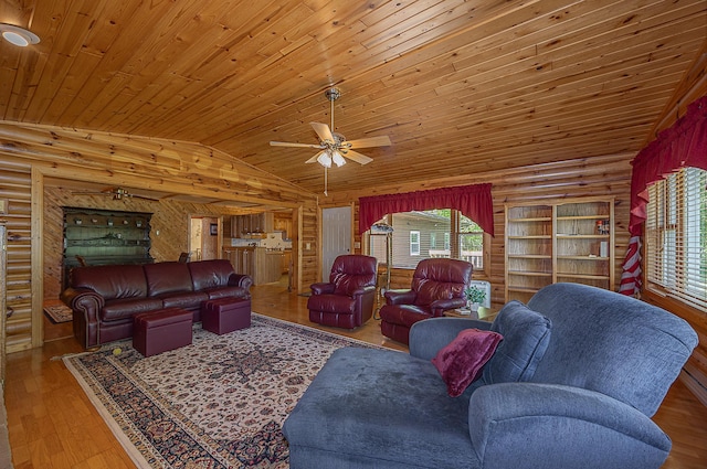 224 Norman Point Rd NW, Longville, MN 56655 - living room featuring ceiling fan, vaulted ceiling, wooden ceiling, hardwood / wood-style floors, and log walls