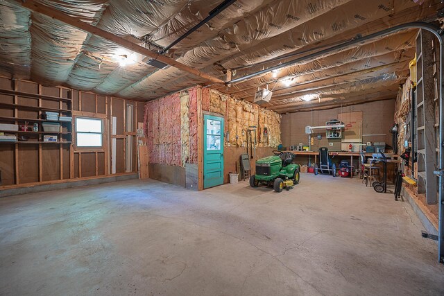 224 Norman Point Rd NW, Longville, MN 56655 - garage featuring a garage door opener and a workshop area