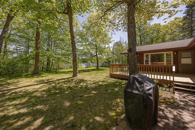 224 Norman Point Rd NW, Longville, MN 56655 - view of grassy yard featuring a deck