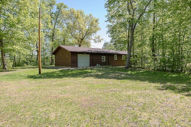 224 Norman Point Rd NW, Longville, MN 56655 - view of green lawn featuring an attached garage
