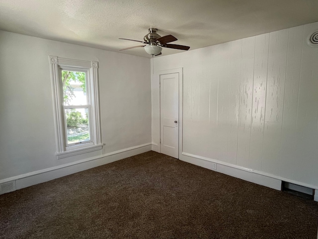 1030 28th Ave NE, Minneapolis, MN 55418 - unfurnished room with dark carpet and a ceiling fan