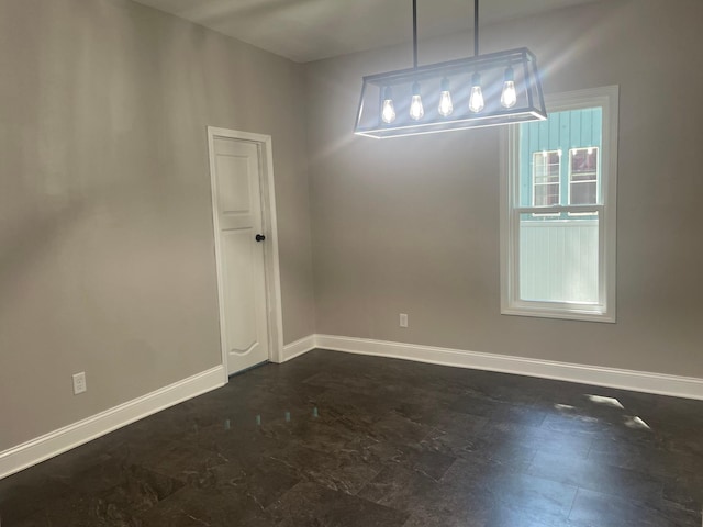 309 4th St, Marshall, MN 56258 - unfurnished dining area featuring baseboards