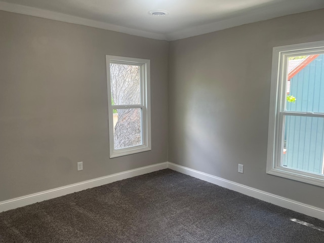 309 4th St, Marshall, MN 56258 - spare room with baseboards and dark colored carpet