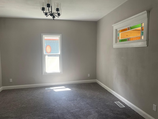 309 4th St, Marshall, MN 56258 - unfurnished room with a chandelier, carpet floors, and baseboards