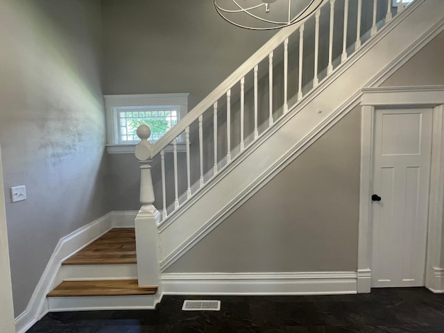 309 4th St, Marshall, MN 56258 - stairway featuring baseboards and a high ceiling