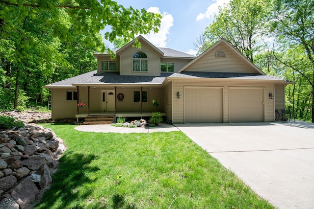 100 Hill Dr, Lime Twp, MN 56001 - view of front of property featuring covered porch, an attached garage, roof with shingles, driveway, and a front lawn