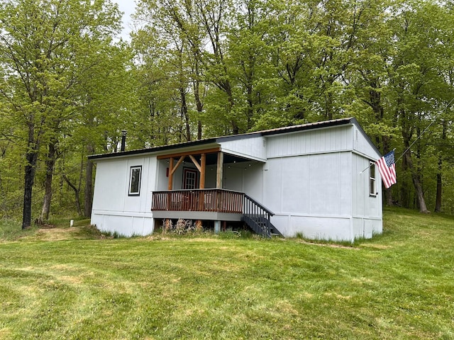 11216 State Highway 27, Beaver Twp, MN 55783 - view of front of house with a front lawn and a view of trees