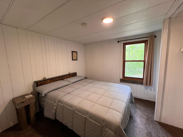 11216 State Highway 27, Beaver Twp, MN 55783 - bedroom featuring dark carpet