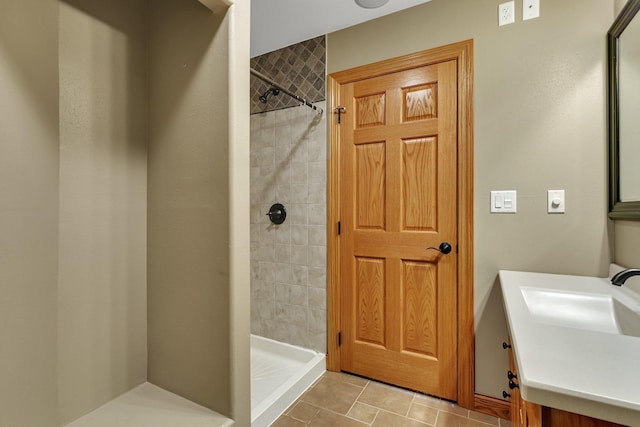 bathroom featuring a sink and a stall shower