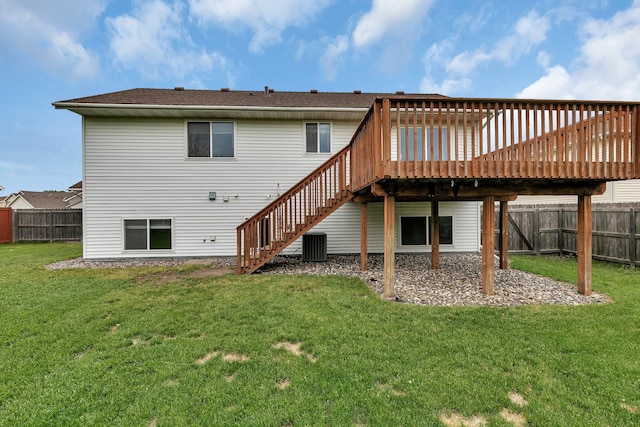 back of property with a deck, stairs, and central AC unit