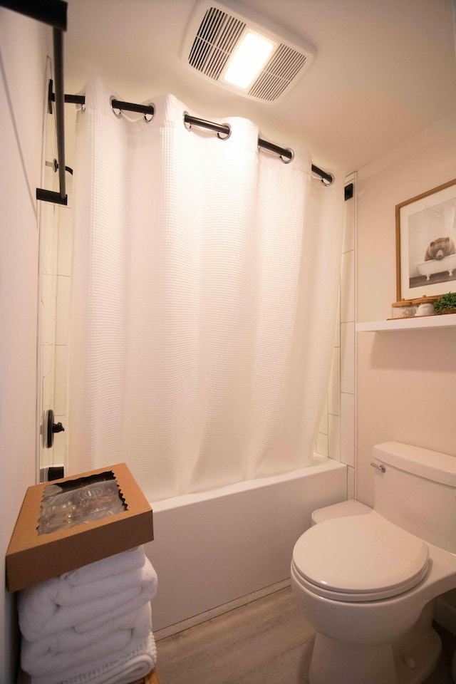 123 Bridge Run Ln Unit B, Lutsen Twp, MN 55612 - bathroom featuring shower / bath combo, toilet, and wood finished floors