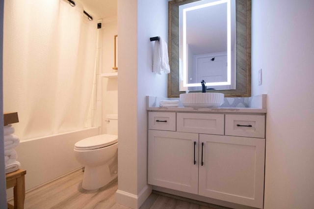 123 Bridge Run Ln Unit B, Lutsen Twp, MN 55612 - bathroom with wood finished floors, toilet, shower / bathtub combination with curtain, and vanity
