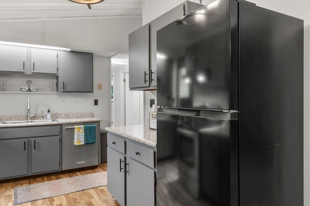 750 Prairie Ave SE, Cokato, MN 55321 - kitchen featuring freestanding refrigerator, a sink, dishwasher, and gray cabinets