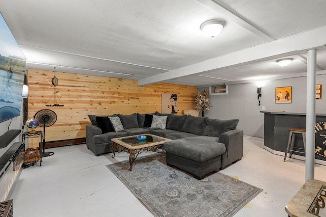 750 Prairie Ave SE, Cokato, MN 55321 - living room featuring wooden walls, finished concrete flooring, and a dry bar