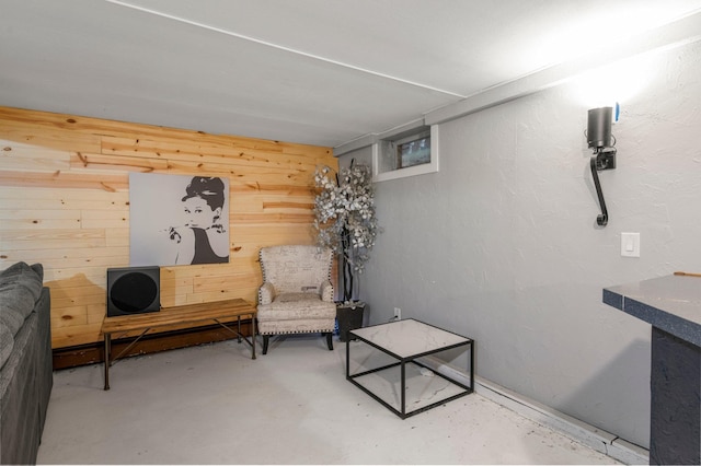 750 Prairie Ave SE, Cokato, MN 55321 - sitting room with unfinished concrete flooring and wooden walls