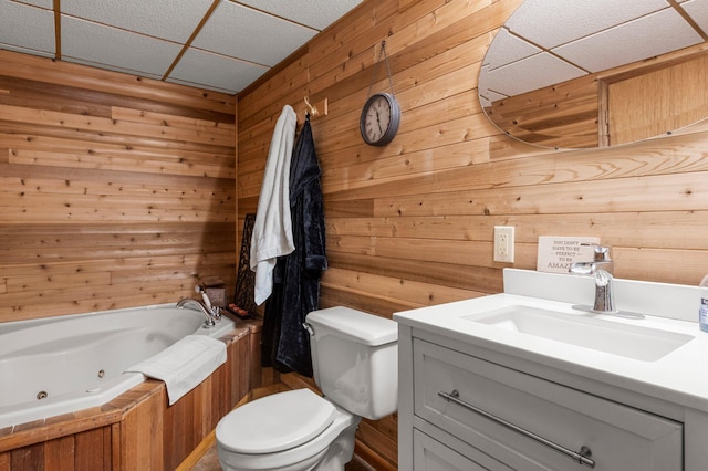 750 Prairie Ave SE, Cokato, MN 55321 - full bath with a paneled ceiling, a tub with jets, wood walls, toilet, and vanity