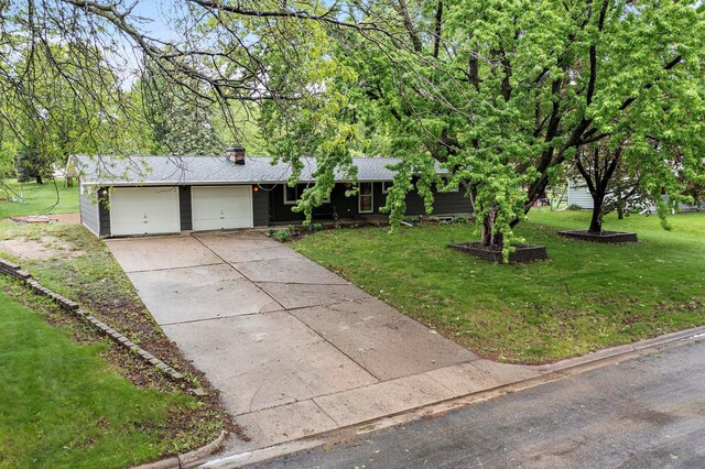 750 Prairie Ave SE, Cokato, MN 55321 - ranch-style home with an attached garage, a front lawn, concrete driveway, and roof with shingles