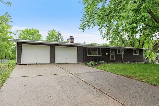 750 Prairie Ave SE, Cokato, MN 55321 - ranch-style home with a garage, a chimney, a front yard, and concrete driveway