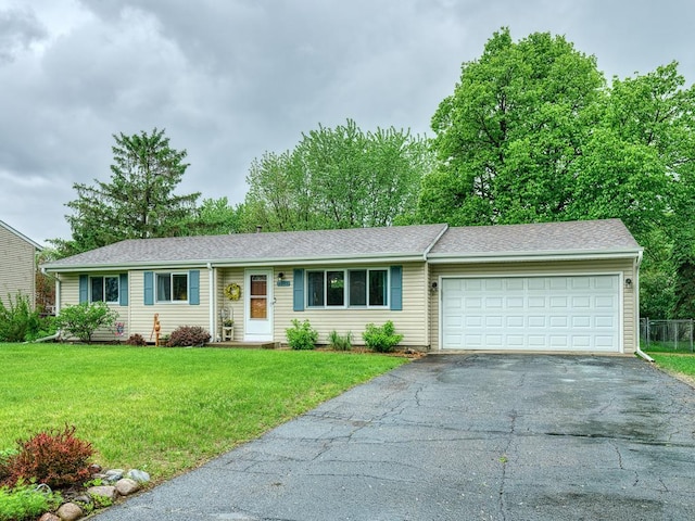 7349 Drew Ave N, Brooklyn Park, MN 55443 - ranch-style house featuring asphalt driveway, a garage, a front lawn, and a shingled roof
