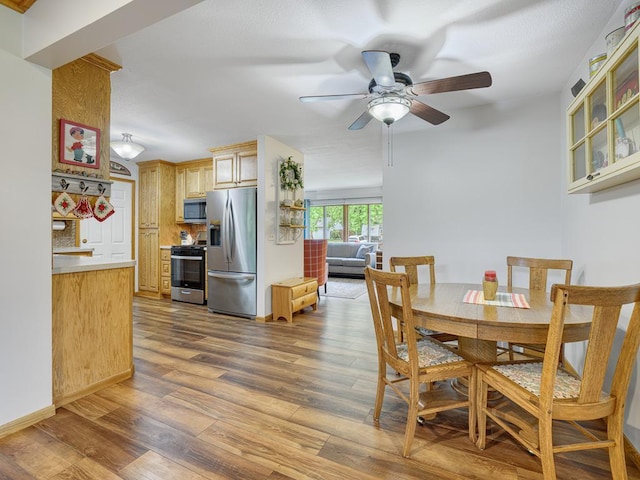 7349 Drew Ave N, Brooklyn Park, MN 55443 - dining room featuring a ceiling fan and wood finished floors