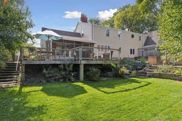 1215 Eleanor Ave, Saint Paul, MN 55116 - rear view of house with stairway, a chimney, a wooden deck, and a yard