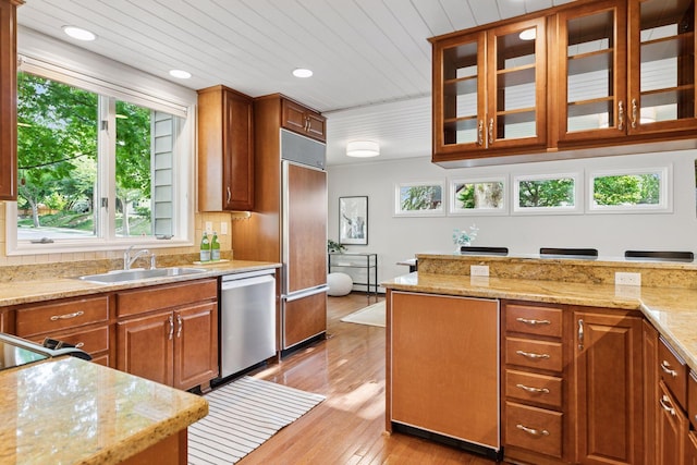1215 Eleanor Ave, Saint Paul, MN 55116 - kitchen featuring stainless steel dishwasher, a sink, paneled built in refrigerator, light wood-style flooring, and plenty of natural light